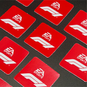 Square EA Sports F1 vinyl stickers displayed on a dark surface